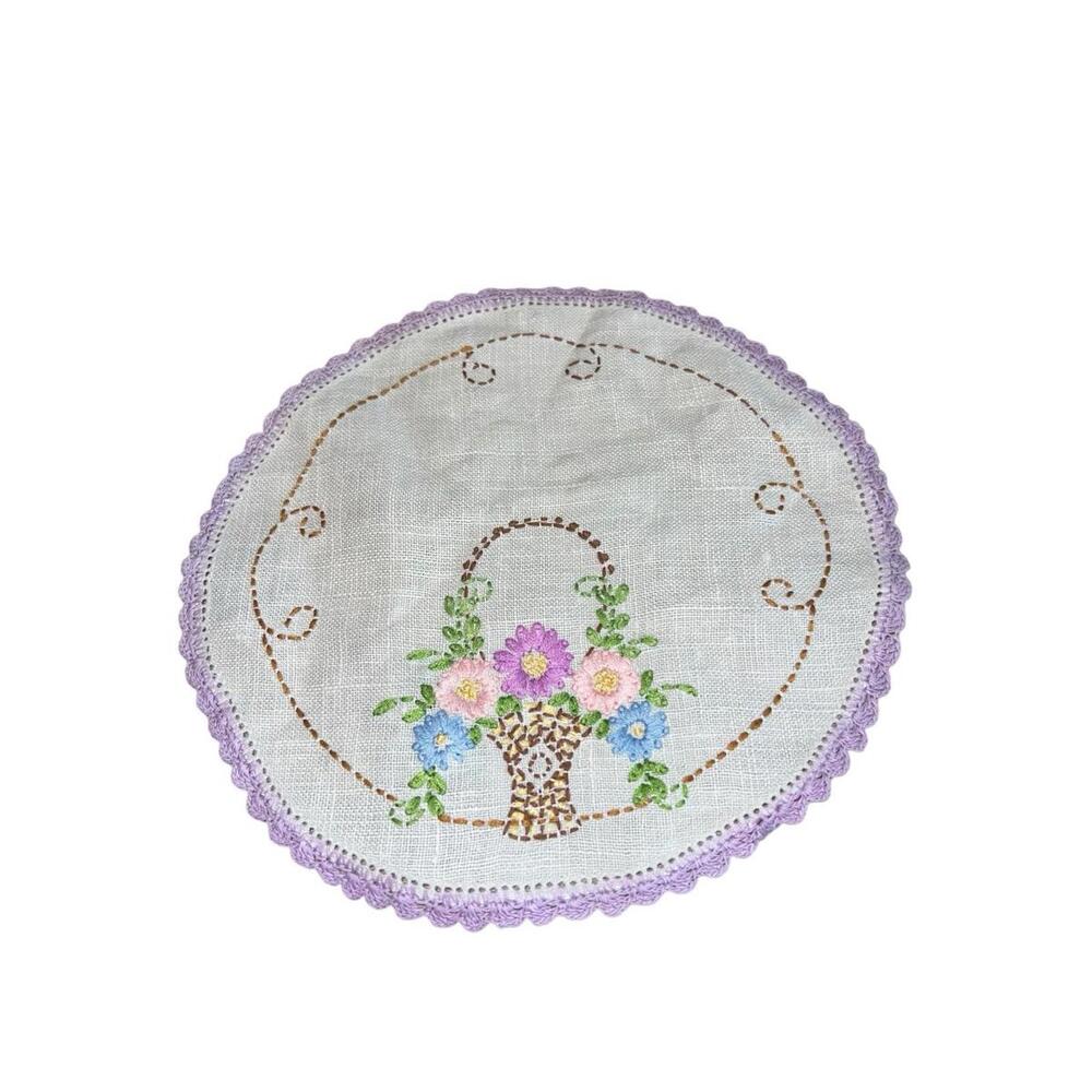 Vintage handmade 8 1/4 inch doily with flower basket embroidery and crochet trim